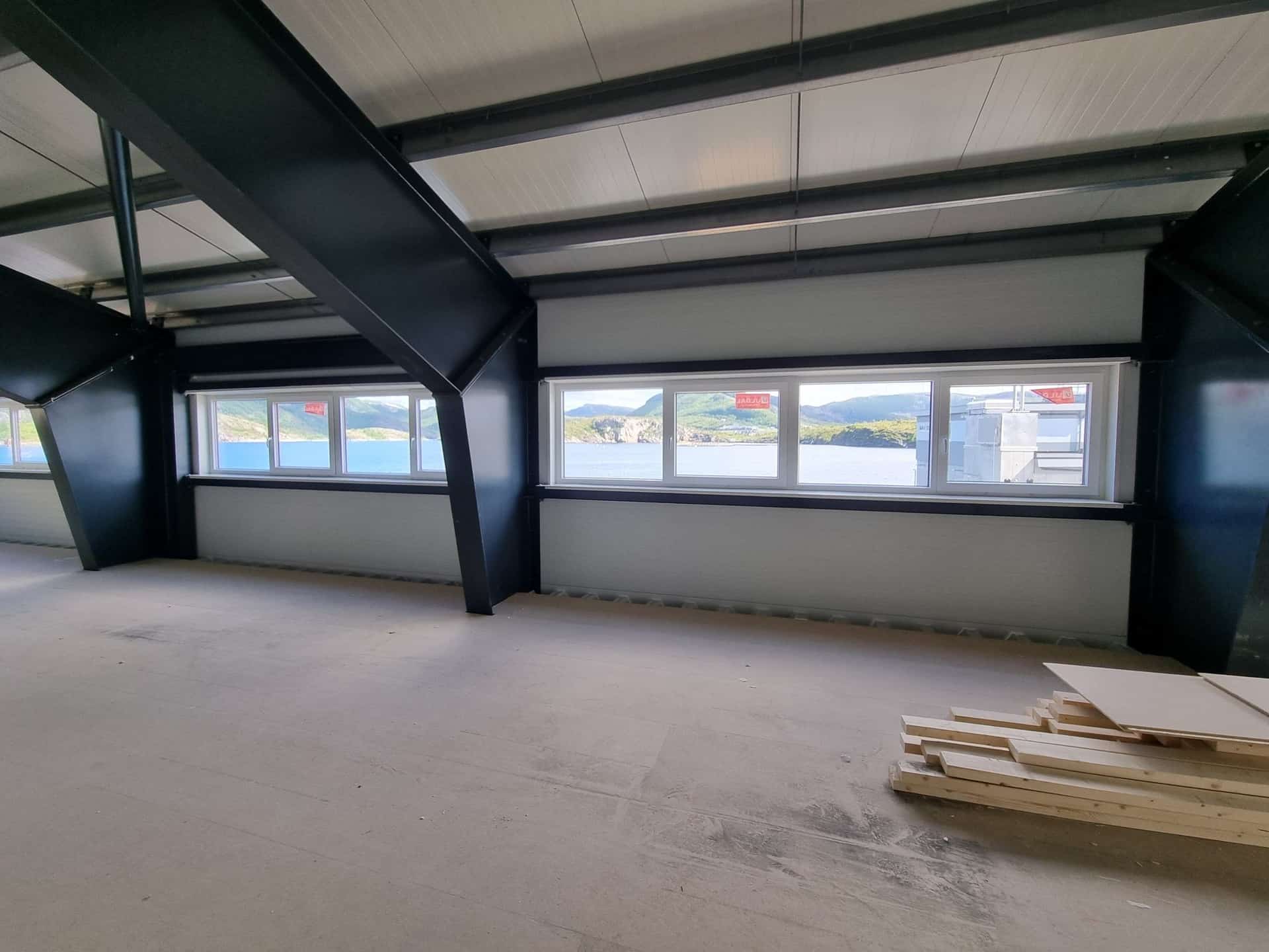 Mezzanine office floor with windows and views, before fit-out